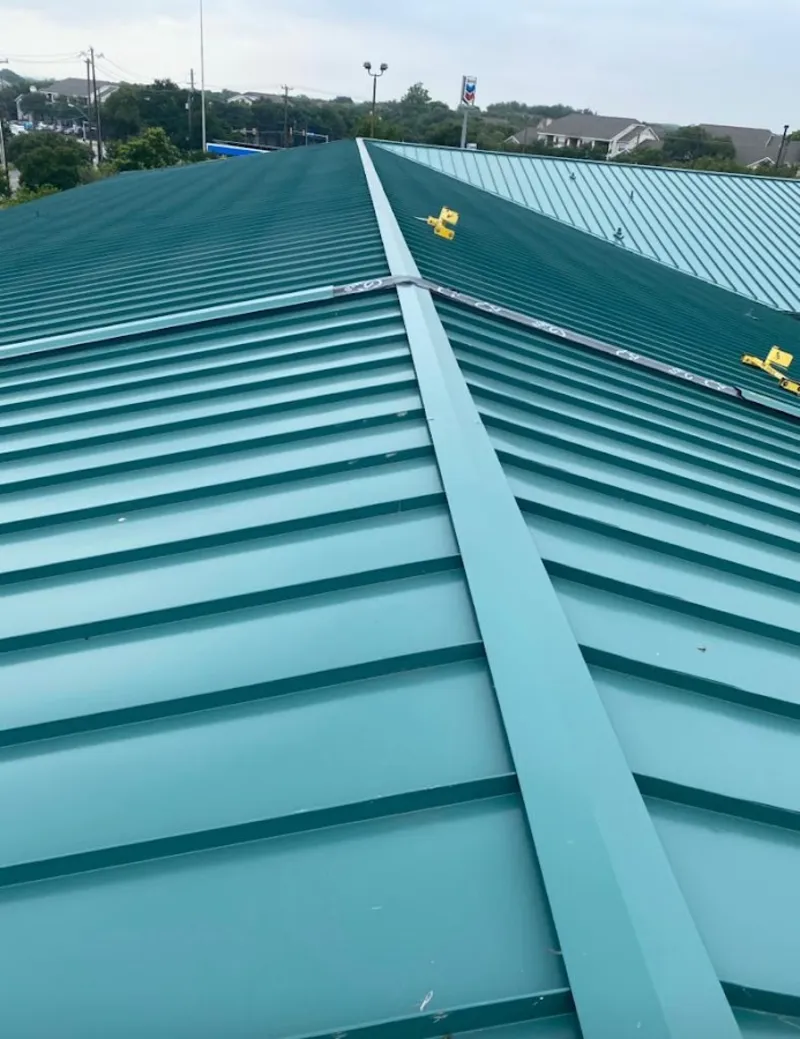 Green commercial metal roof ridge and valley for Metal Roof Repair in Blackhawk