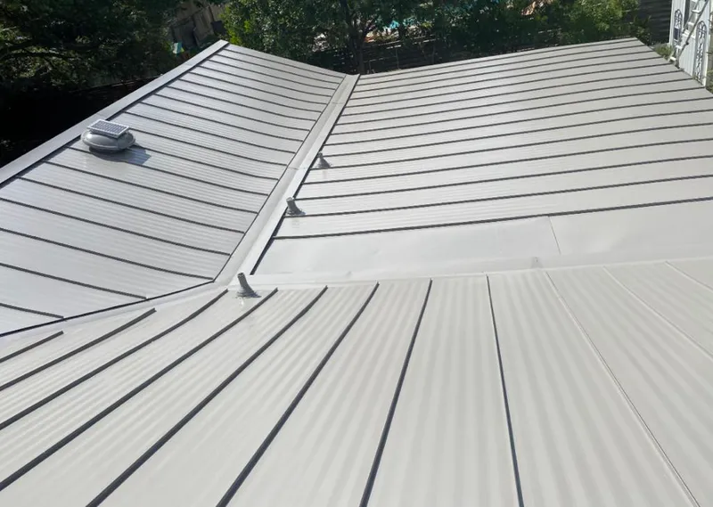 Solar attic fan installed on a metal roof for Roof Ventilation in Blackhawk
